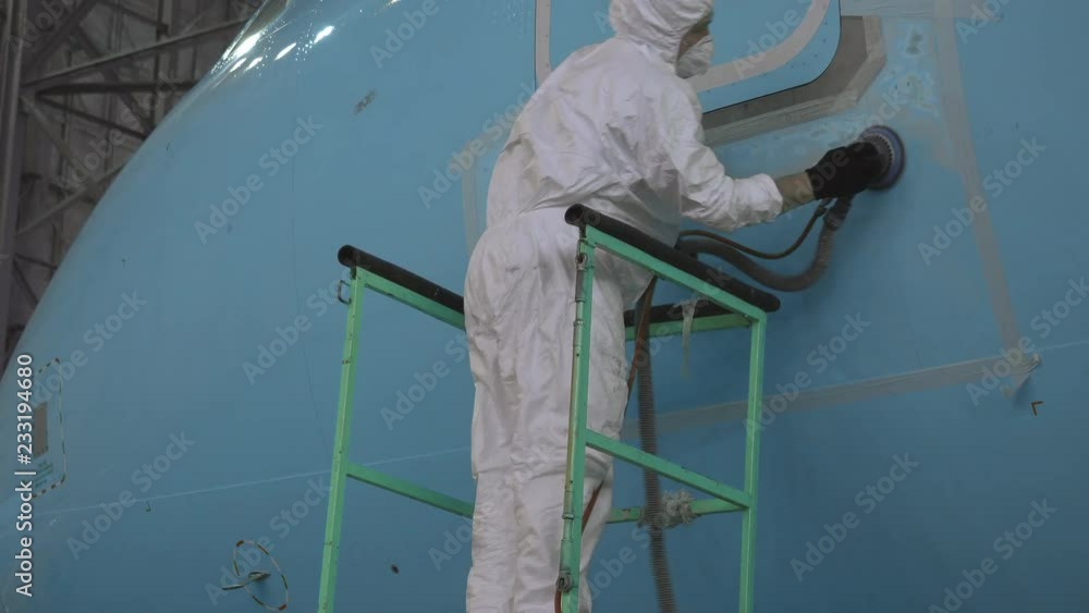 Video Stock Painting the aircraft at the factory. The engineer ...