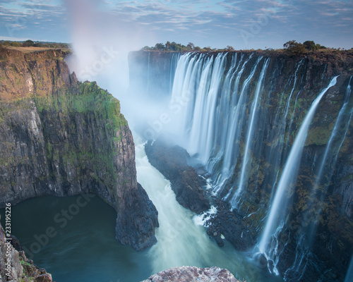 Fototapeta Naklejka Na Ścianę i Meble -  Early morning at Victoria Falls from Zambia looking into Zimbabwe