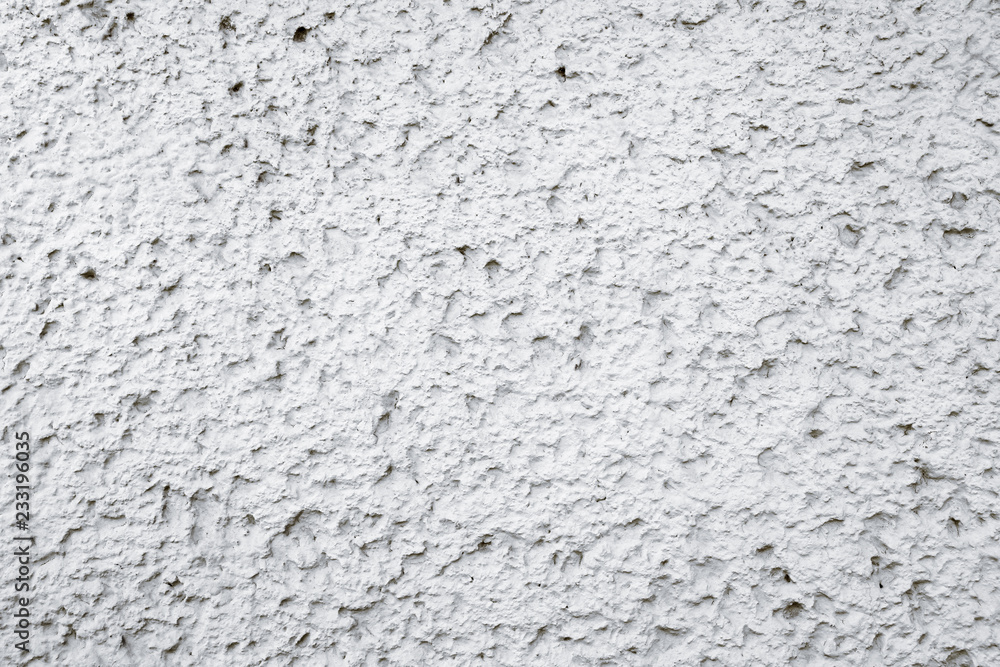Old grungy white and grey concrete cement wall with imperfections as rough surface texture background.