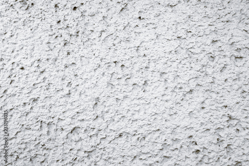 Old grungy white and grey concrete cement wall with imperfections as rough surface texture background.
