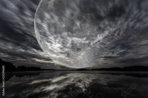 Canvas Print Mystery landscape, big full moon over dark lake, long exposure shot