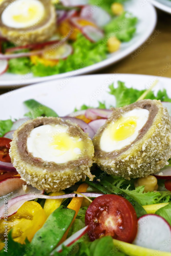 Plates with scottish eggs Plates with scottish eggs