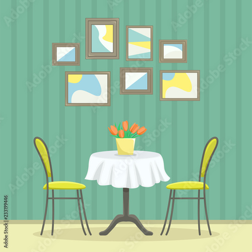 Restaurant interior in classic style. Table with chairs near the wall with pictures.