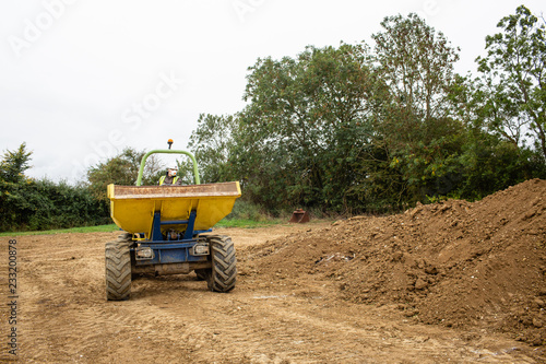 Image of front dumper truck in construction site. Copy space.
