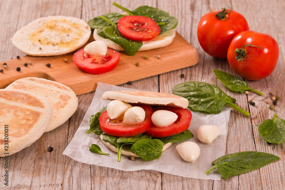 Tigella bread with spinach and tomatoes. Tigella bread with spinach and tomatoes.