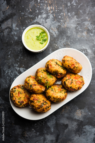 Crispy Corn Tikki, pakora/pakoda or pattice also known as cutlet. served with green chutney. Selective focus