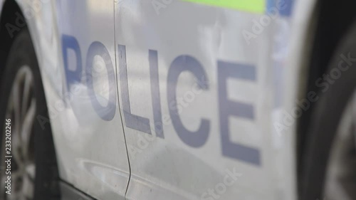 UK Police: Focus pull through police sign on british police car, UK