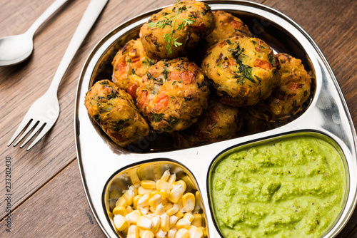 Crispy Corn Tikki, pakora/pakoda or pattice also known as cutlet. served with green chutney. Selective focus