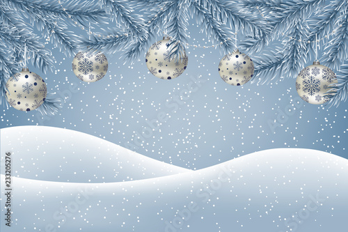  Winter background with falling snow, fir branches decorated with Christmas baubles and garlands, ground covered with snow. Christmas card with space for text.