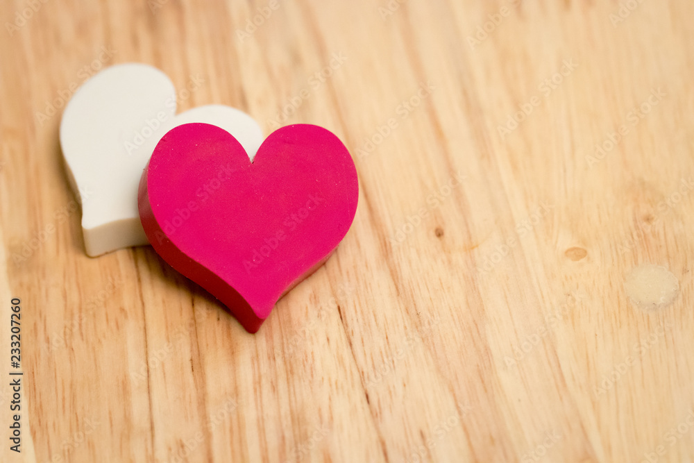 white and red couple hearts on wooden texture background. symbol of love and valentines day. vintage style. can be use to greeting card and background for special event. white and red couple hearts on wooden texture background. symbol of love and valentines day. vintage style. can be use to greeting card and background for special event.