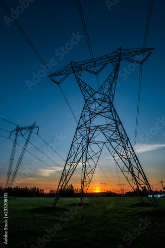 electricity pylons at sunset