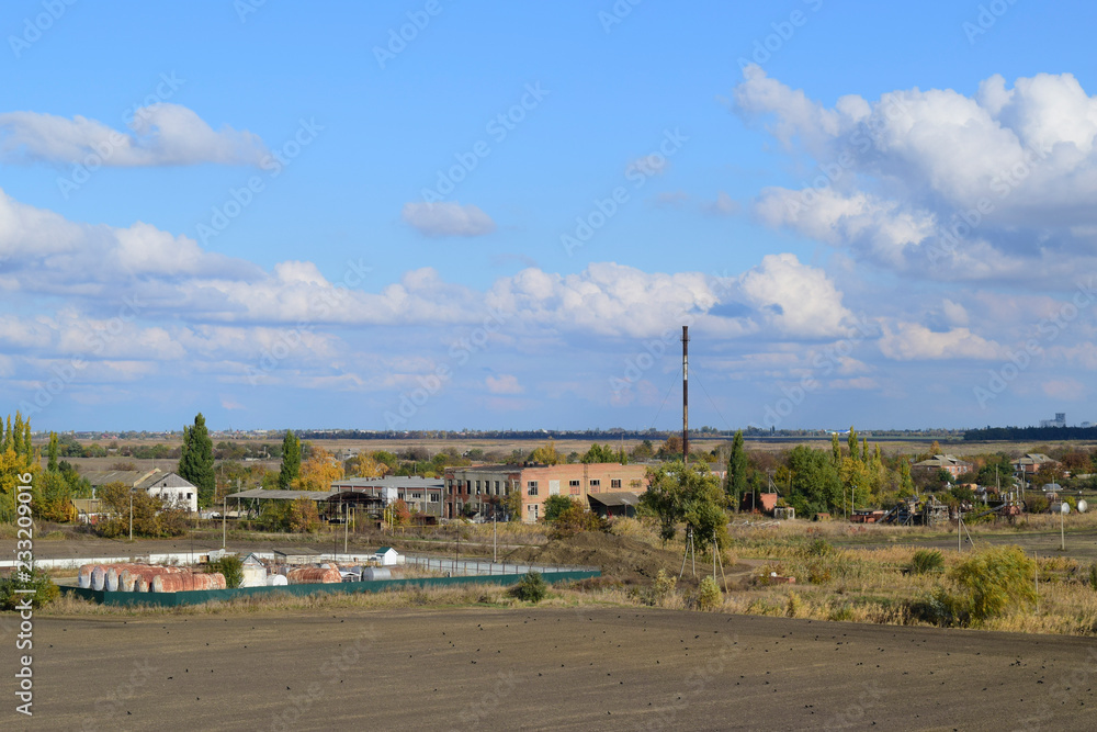 A view from above of a small Russian village. Rural landscape. Field and village. A semi-abandoned village A view from above of a small Russian village. Rural landscape. Field and village. A semi-abandoned village