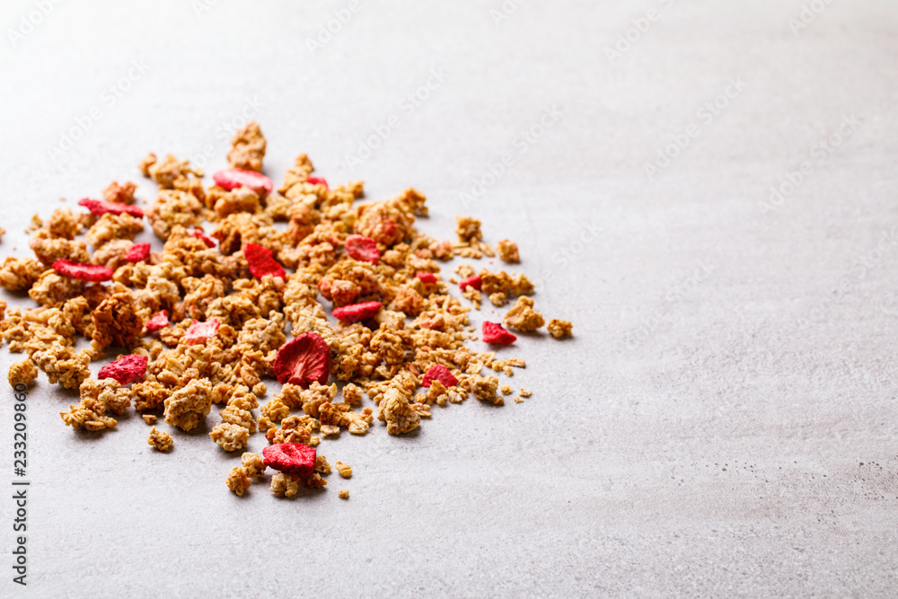 Granola Cereal bar with Strawberries on the Gray Background. Muesli with fruit and berries Useful Breakfast. Healthy Food sweet dessert snack. Diet Nutrition Concept. . Vegetarian food.Copy space Granola Cereal bar with Strawberries on the Gray Background. Muesli with fruit and berries Useful Breakfast. Healthy Food sweet dessert snack. Diet Nutrition Concept. . Vegetarian food.Copy space