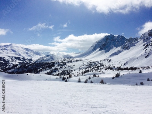 panorama of mountains covered by snow at the winter