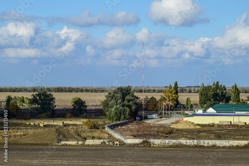 Wallpaper Mural A view from above of a small Russian village. Rural landscape. Field and village. A semi-abandoned village Torontodigital.ca
