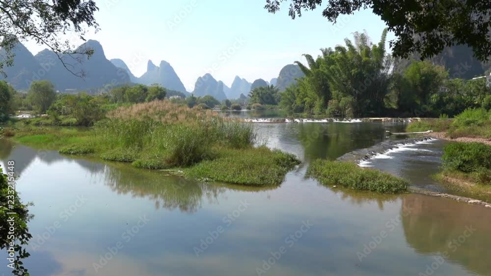 Time lapse of karst mountains and limestone peaks of Yulong River, Yangshuo, Guilin, China Time lapse of karst mountains and limestone peaks of Yulong River, Yangshuo, Guilin, China