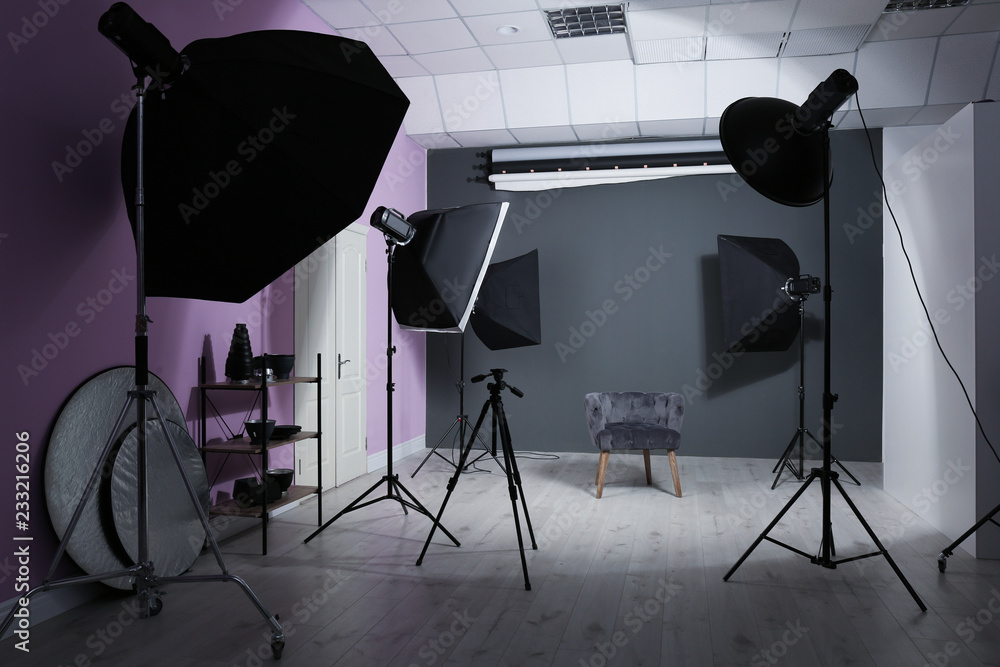 Interior of modern photo studio with professional equipment - obrazy, fototapety, plakaty 