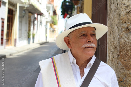 Elderly latino man looking away photo