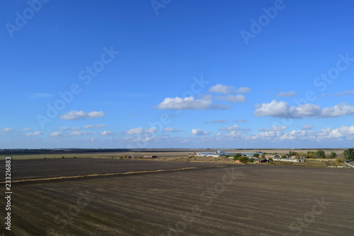 plowed field in the spring in the village. Agricultural land in the Kuban. Preparation of fields for sowing wheat