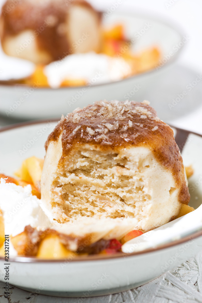 portioned cake with cream and fruit, vertical closeup portioned cake with cream and fruit, vertical closeup