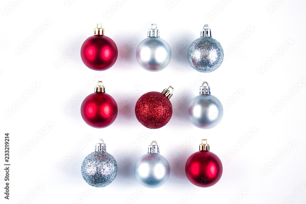 Nine Christmas red and silver balls with shadows on a white background. New Year's composition. square Nine Christmas red and silver balls with shadows on a white background. New Year's composition. square