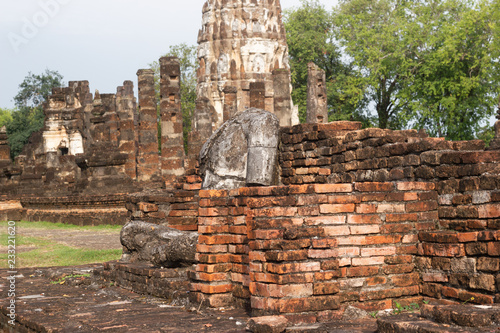 The old buddha image on cement with ruins and ancient, Built in modern history in historical park is the UNESCO world heritage, Sukhothai Thailand.