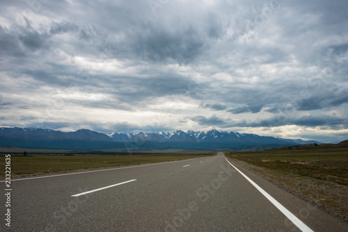 Empty route in Altai mountains on snowly peaks of North-Chui ridge of Altai mountains © olinchuk