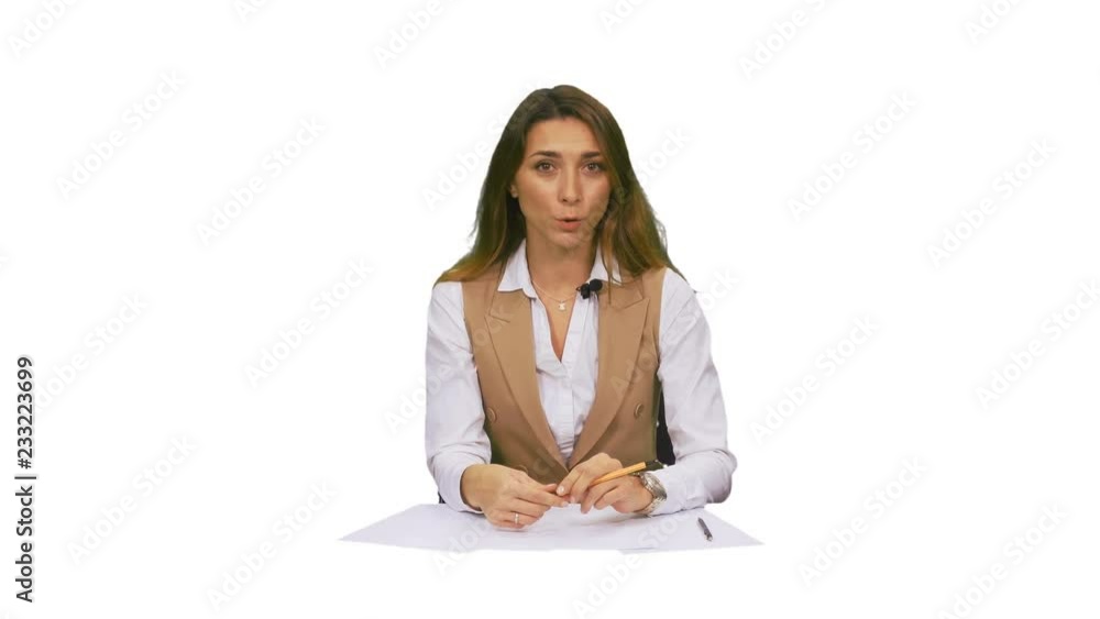 An anchorwoman, tv presenter sitting in a studio and talking, footage with alpha channel An anchorwoman, tv presenter sitting in a studio and talking, footage with alpha channel