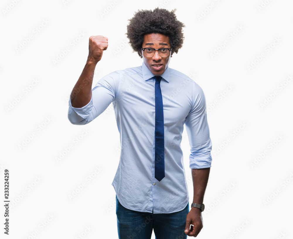 Afro american business man wearing glasses over isolated background angry and mad raising fist frustrated and furious while shouting with anger. Rage and aggressive concept. Afro american business man wearing glasses over isolated background angry and mad raising fist frustrated and furious while shouting with anger. Rage and aggressive concept.