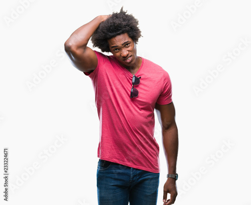 Afro american man over isolated background confuse and wonder about question. Uncertain with doubt, thinking with hand on head. Pensive concept.