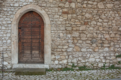 Old wooden door on Wawel Castle in Krakow