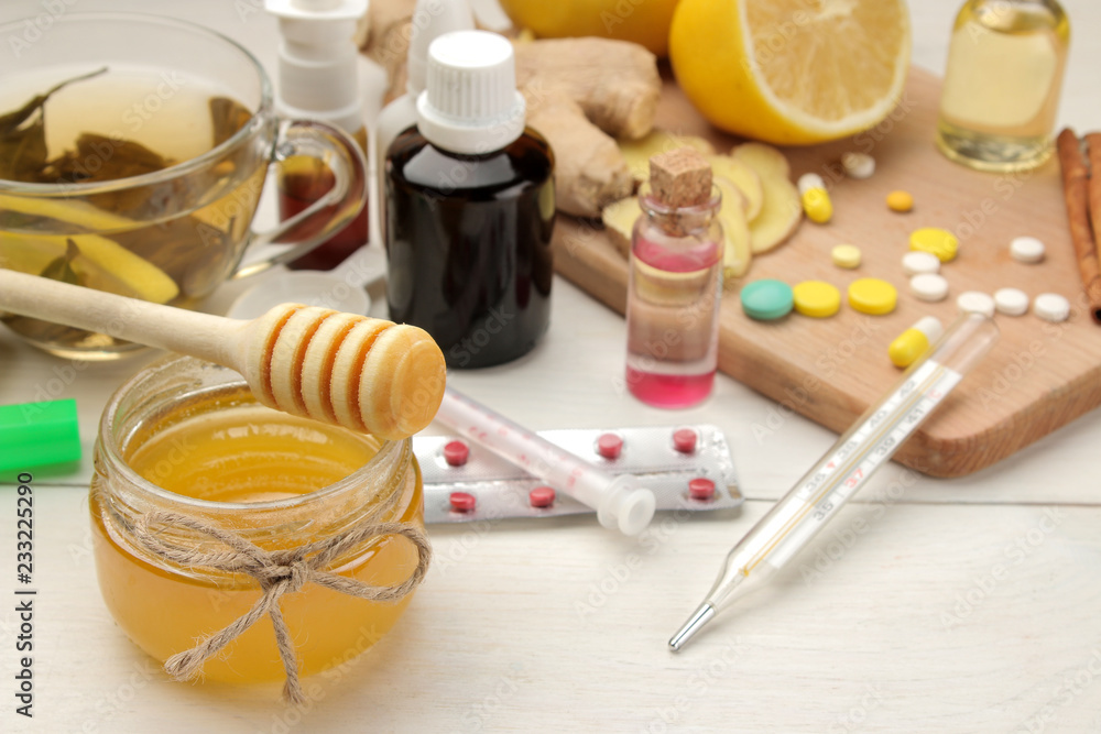 Various medicines for flu and cold remedies on a white wooden table .. Cold. diseases. cold. flu. Various medicines for flu and cold remedies on a white wooden table .. Cold. diseases. cold. flu.