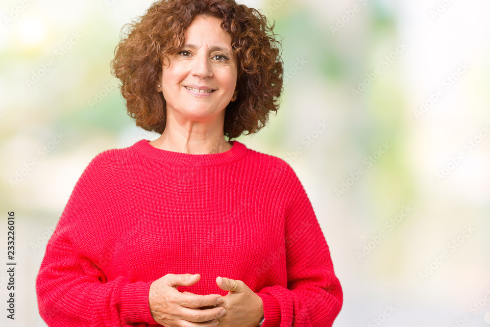 Beautiful middle ager senior woman red winter sweater over isolated background Hands together and fingers crossed smiling relaxed and cheerful. Success and optimistic Beautiful middle ager senior woman red winter sweater over isolated background Hands together and fingers crossed smiling relaxed and cheerful. Success and optimistic