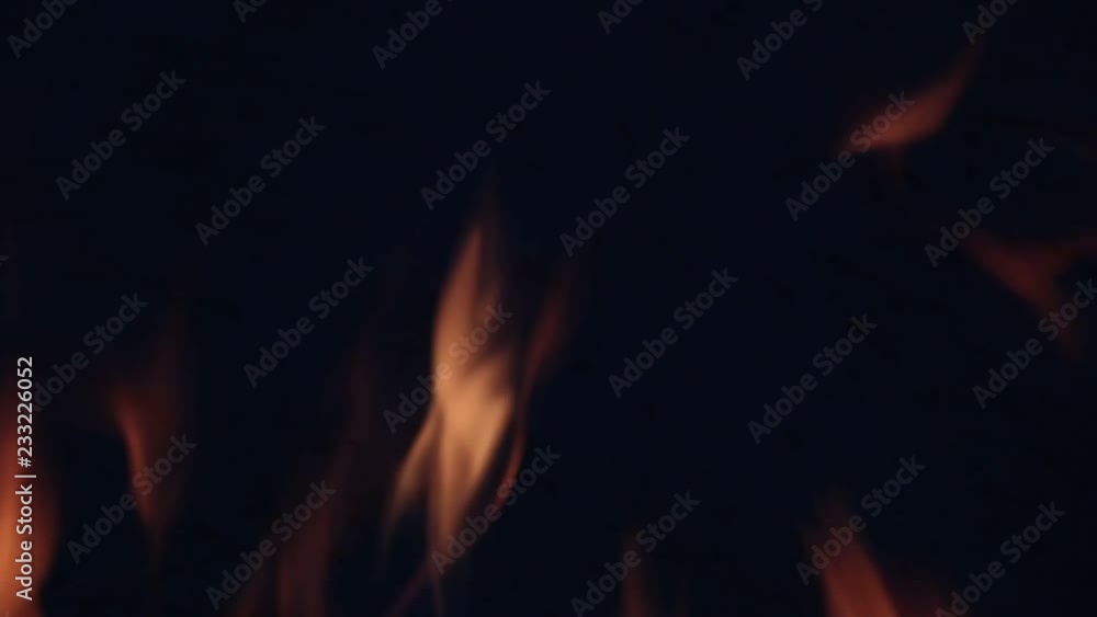 yellow flames on dark gray concrete background yellow flames on dark gray concrete background