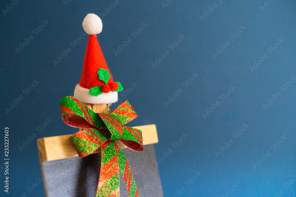 Christmas concept background.Christmas ribbon decoration with santa hat and copy space.