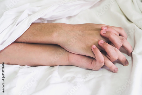 Hands of couple lover sex on the bed,Concept about love, sex and lifestyle.