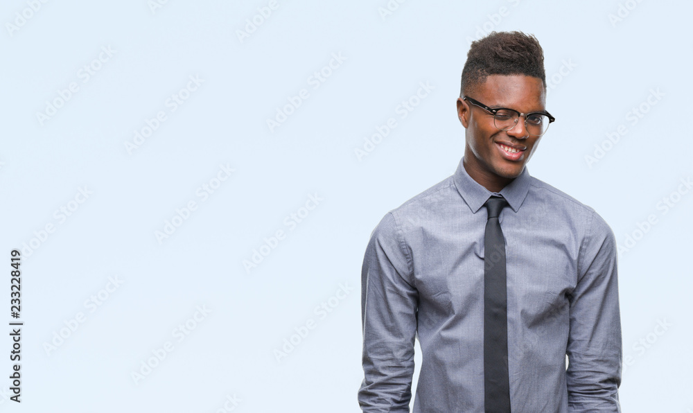 Young african american business man over isolated background winking looking at the camera with sexy expression, cheerful and happy face. Young african american business man over isolated background winking looking at the camera with sexy expression, cheerful and happy face.