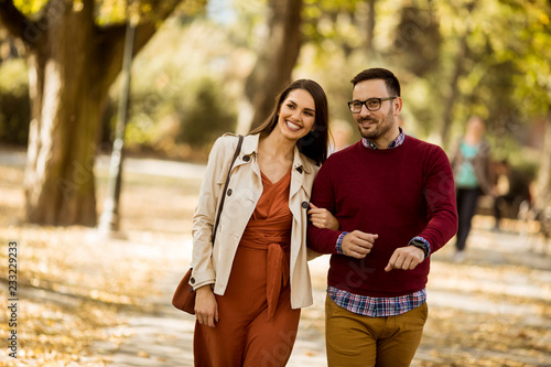 Young woman and man walking...