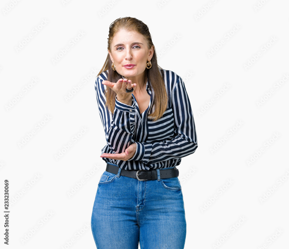 Middle age mature business woman over isolated background looking at the  camera blowing a kiss with hand on air being lovely and sexy. Love  expression. foto de Stock | Adobe Stock