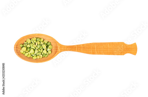 Dry green peas in spoon