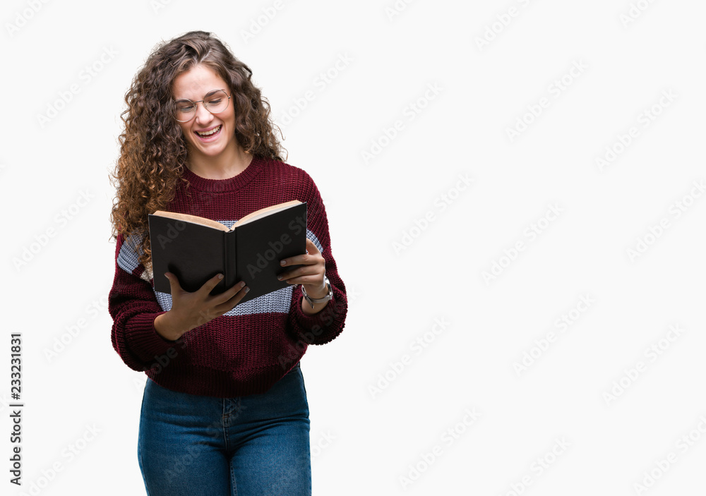 Young brunette girl reading a book wearing glasses over isolated background with a happy face standing and smiling with a confident smile showing teeth Young brunette girl reading a book wearing glasses over isolated background with a happy face standing and smiling with a confident smile showing teeth