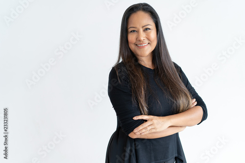 Fotografie Confident middle-aged lady looking at camera