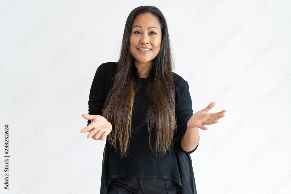 Smiling middle-aged woman asking question. Attractive lady looking at camera. Question concept. Isolated front view on white background. Smiling middle-aged woman asking question. Attractive lady looking at camera. Question concept. Isolated front view on white background.