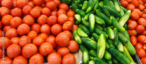 Tomatoes and Cucumbers at a Produce Stand