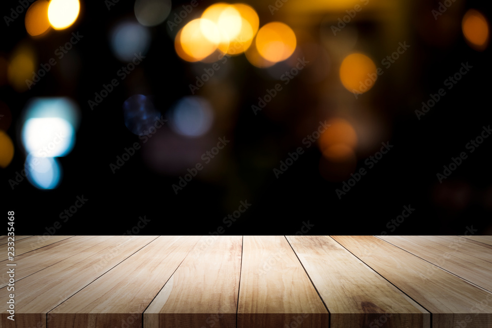 Empty wooden table platform and bokeh at night.