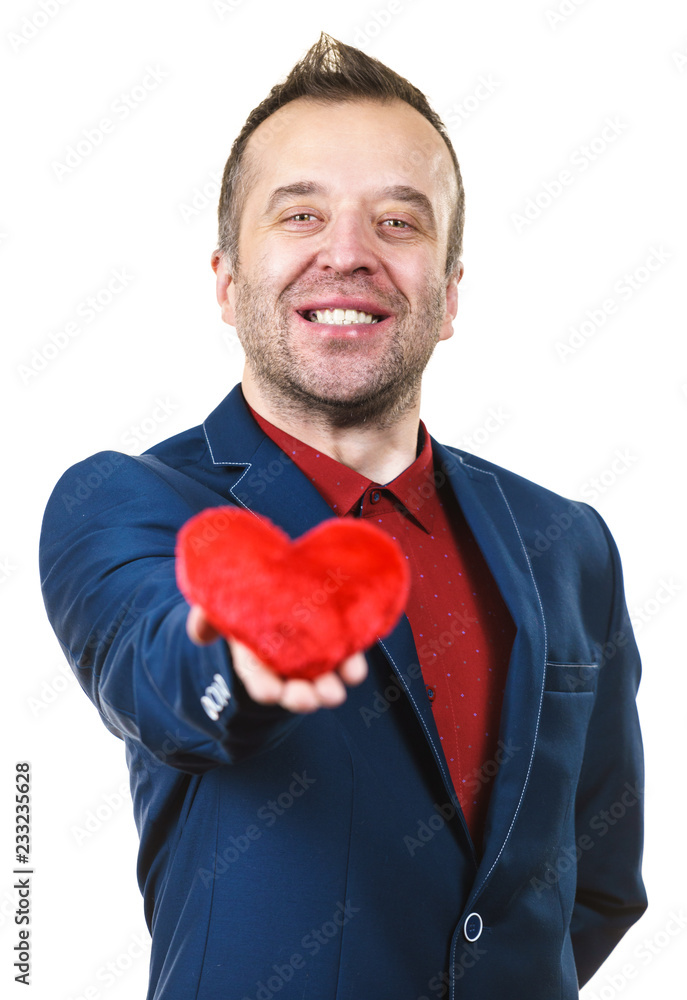 Man in suit holding heart