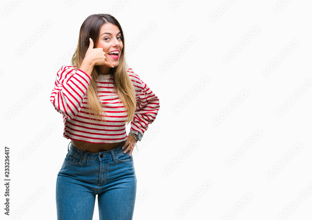 Young beautiful woman casual stripes winter sweater over isolated background smiling doing phone gesture with hand and fingers like talking on the telephone. Communicating concepts. Young beautiful woman casual stripes winter sweater over isolated background smiling doing phone gesture with hand and fingers like talking on the telephone. Communicating concepts.