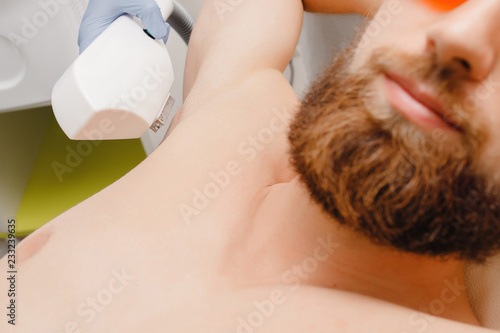 Smooth skin man under arms. Laser hair removal.