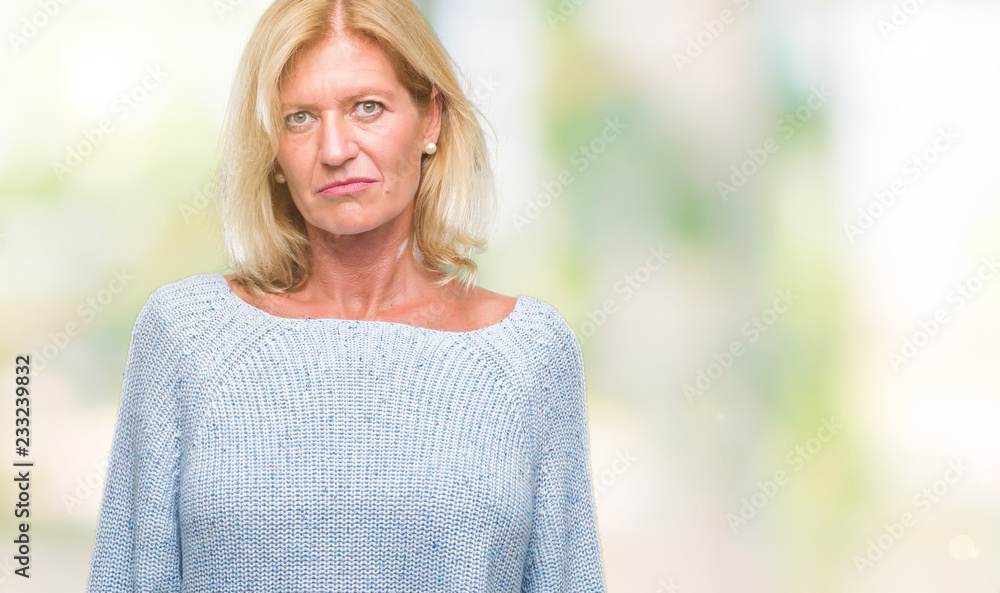 Middle age blonde woman wearing winter sweater over isolated background depressed and worry for distress, crying angry and afraid. Sad expression. Middle age blonde woman wearing winter sweater over isolated background depressed and worry for distress, crying angry and afraid. Sad expression.