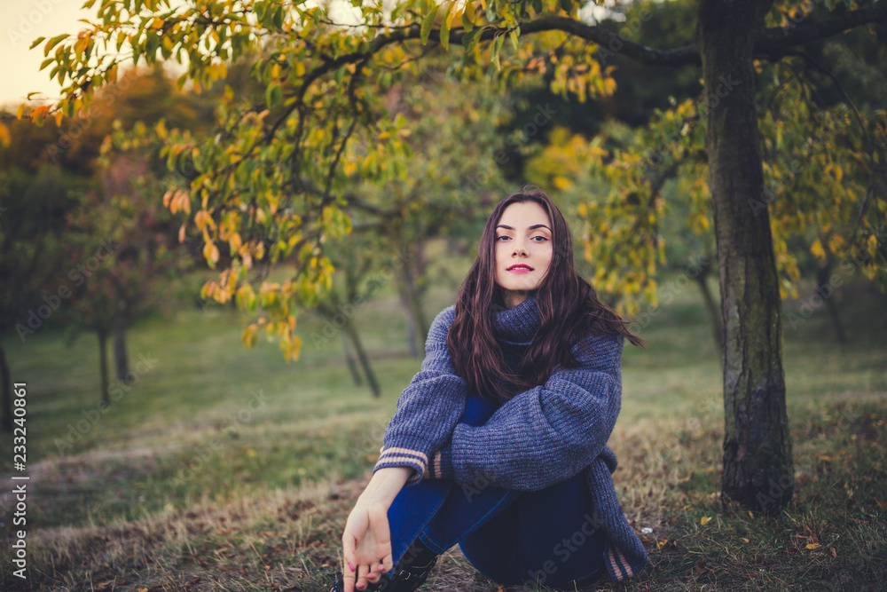 Beautiful girl in a sweater in an autumn park Beautiful girl in a sweater in an autumn park